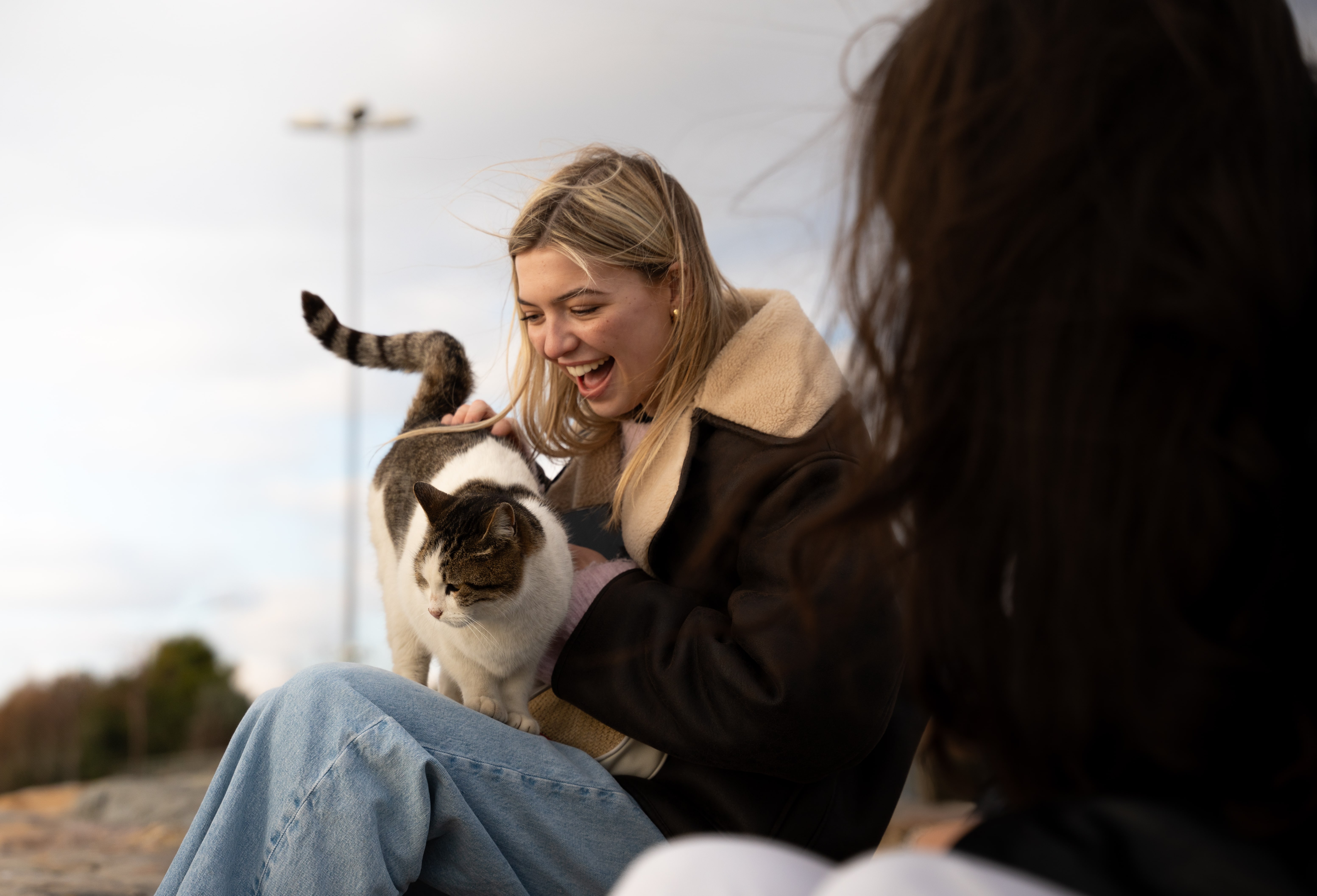 Student holding a cat in Turkey